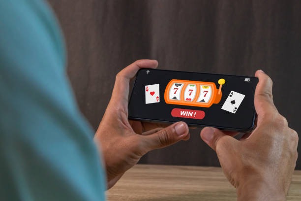 Yggdrasil slot game selection and football live standings displayed side-by-side on smart aoncash mobile interface